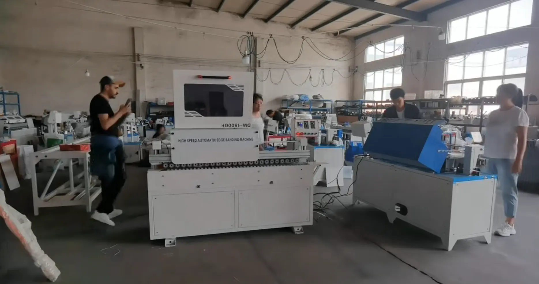 Overseas buyer inspecting woodworking machinery